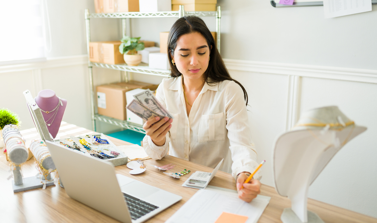 Woman calculating Investment profits from online business