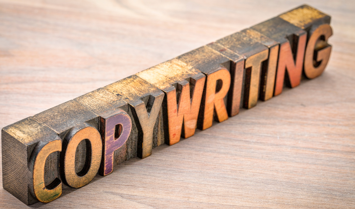 A wooden letter carving depicting word copywriting.